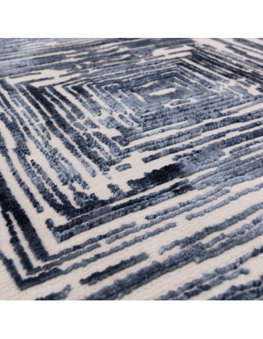 Elevate your space with the Kuza Portrait Navy modern luxury rug, featuring a lustrous geometric design and soft, durable synth