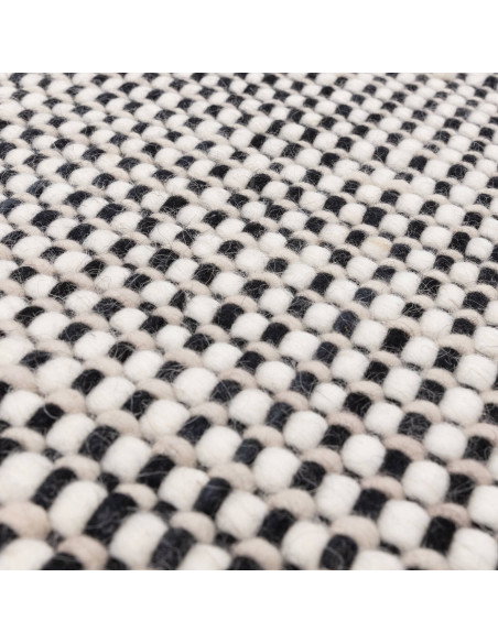 Tappeto Avalon Monochrome in lana naturale, design elegante e artigianale, perfetto per soggiorni moderni con stile e comfort.
