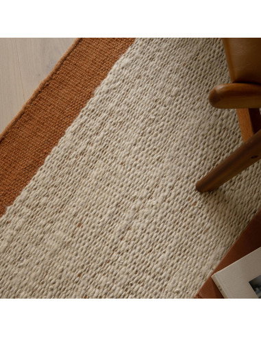 Elevate your space with the Lima Rust natural fibre rug—handwoven wool design featuring warm rust borders for timeless style an