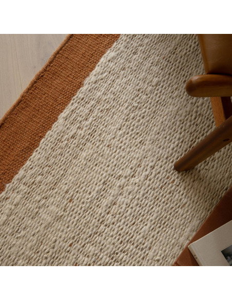 Elevate your space with the Lima Rust natural fibre rug—handwoven wool design featuring warm rust borders for timeless style an