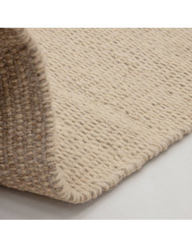 Tappeto Lima Sand in lana naturale, design tinta unita perfetto per un soggiorno elegante e accogliente. Qualità artigianale e