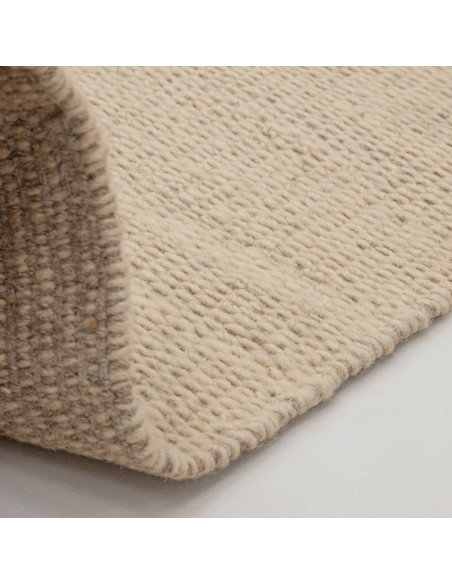 Tappeto Lima Sand in lana naturale, design tinta unita perfetto per un soggiorno elegante e accogliente. Qualità artigianale e