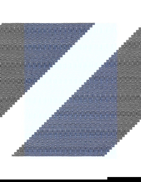 Tappeto Sloan Blue in lana e cotone, design geometrico e fibre naturali, perfetto per un soggiorno moderno e sostenibile.