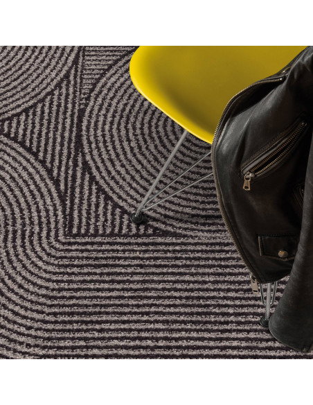 Elevate your space with the Muse Charcoal Swirl MU01, a durable modern designer rug featuring a stylish geometric pattern and p