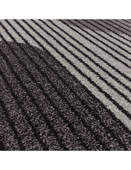 Elevate your space with the Muse Grey Retro MU14, a modern designer rug featuring striking geometric patterns and durable, easy