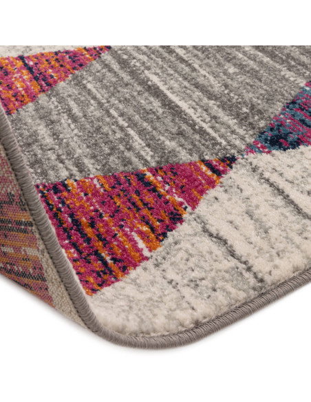 Add vibrant style with the Muse Harlequin Pink MU24, a durable modern colourful area rug featuring geometric flair and easy-car