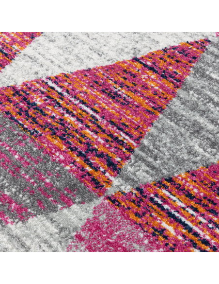 Add vibrant style with the Muse Harlequin Pink MU24, a durable modern colourful area rug featuring geometric flair and easy-car