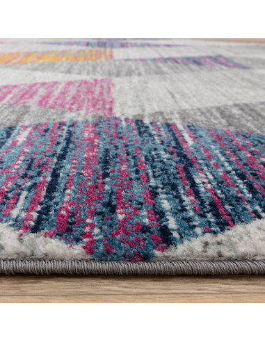 Add vibrant style with the Muse Harlequin Pink MU24, a durable modern colourful area rug featuring geometric flair and easy-car