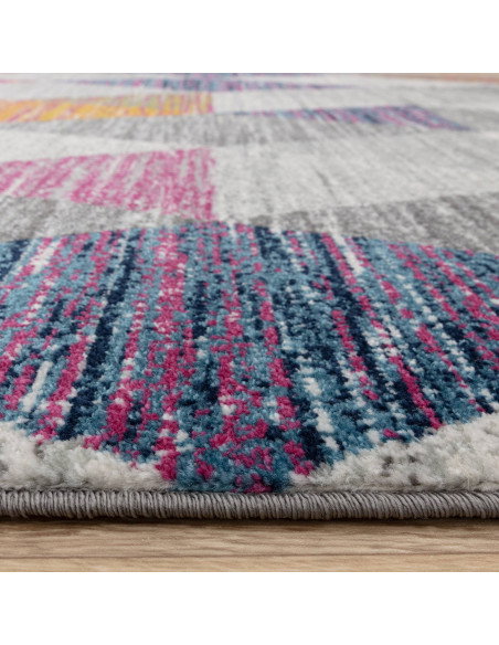 Add vibrant style with the Muse Harlequin Pink MU24, a durable modern colourful area rug featuring geometric flair and easy-car