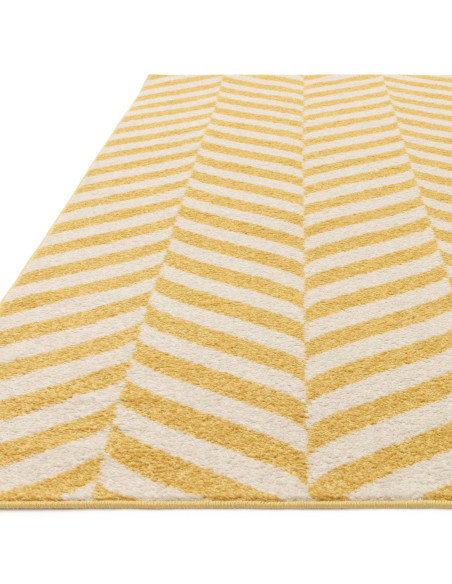 Brighten your space with the Muse Yellow Chevron MU08, a durable modern designer rug featuring vibrant chevron patterns for sty