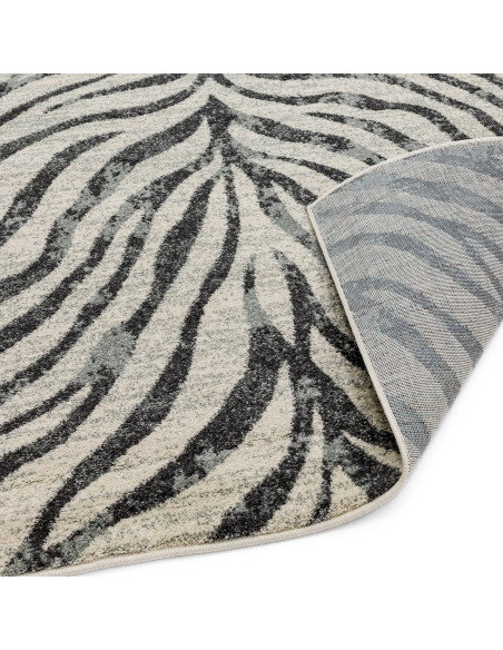 Elevate your space with the Nova NV27 Zebra Grey, a stylish modern area rug featuring a bold zebra pattern and easy-care polypr